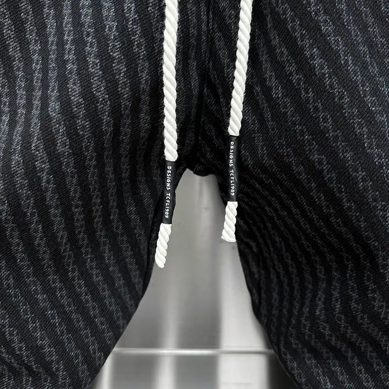 SAINTEND Patterned Snap Joggers – Black Textured Slim-Fit Streetwear Pants